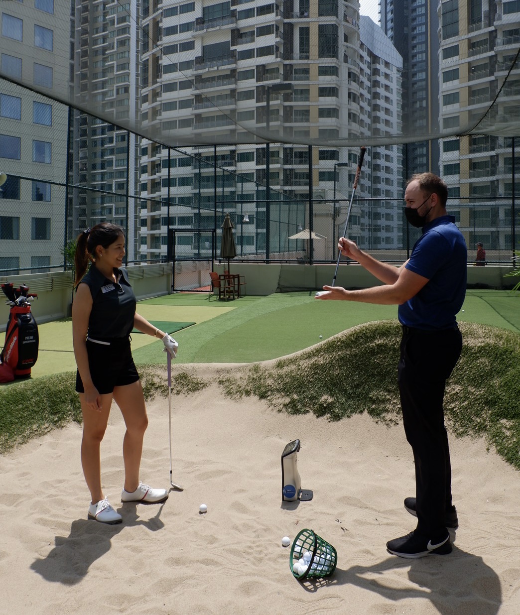 The rooftop short game area overlooking downtown Bangkok